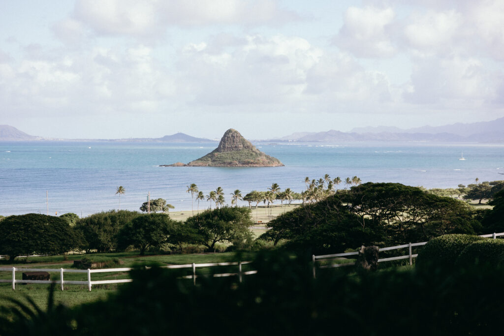 Editorial wedding portrait of couple at Secret Island Beach, Kualoa Ranch, Hawaiʻi