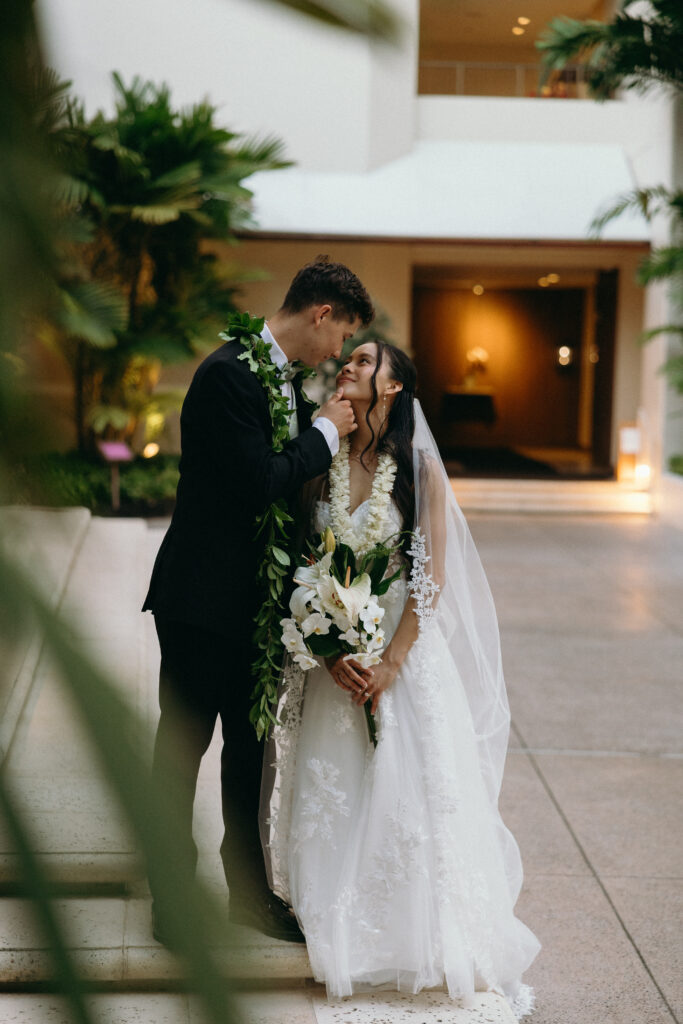 Bride and groom sharing their first look at Halekulani.